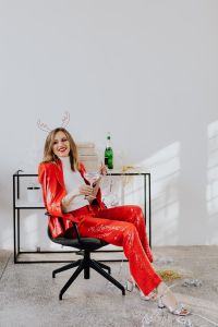 Kaboompics - Champagne Toast While Seated in a Red New Year Party Suit