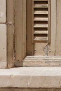 Kaboompics - Close-Up Aged Louvered Shutters with Peeling Paint