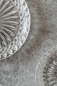 Kaboompics - Textured Gray Marble Background Framed by Two Crystal Dishes, Vertical Copy Space