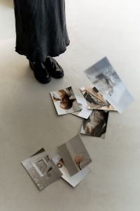 Kaboompics - Motion Blur of Designer Arranging Interior Design Prints on Studio Floor