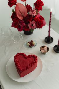 Kaboompics - Romantic Red Table Setting with Flowers, Cake, Candles and Glasses