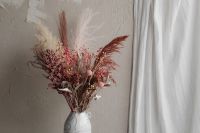 Kaboompics - Soft Pink Dried Bouquet Against Textured Wall