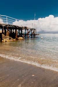 Kaboompics - Soft-Focus View of a White-Railed Pier over the Sea at Marina di Puolo