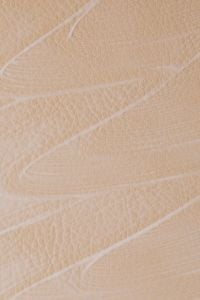 Kaboompics - Fine Translucent Cream Lines on Textured Beige Background, Minimal Skincare Macro