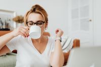 Kaboompics - Close-Up of a Woman Enjoying Coffee During a Relaxed Workday at Home