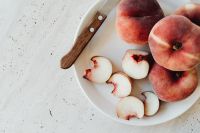 Kaboompics - Overhead Peach Still Life with Fruit Slices, Knife and Copy Space