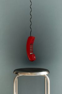 Kaboompics - Red Retro Telephone on Chrome Stool
