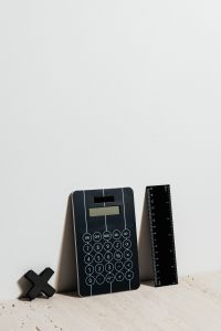 Kaboompics - Black Calculator and Ruler on White Background, Minimal Math Homework Supplies