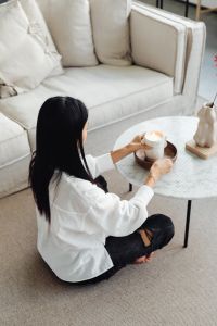 Kaboompics - Hand Lighting a Candle Beside Neutral Decor