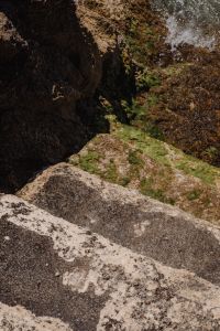 Kaboompics - Green Tinged Rocky Channel with Deep Coastal Shadows