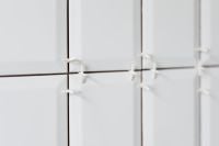 Kaboompics - Laying white ceramic tiles in the bathroom