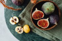 Kaboompics - Fresh Fig Bowl With Sliced Yellow Fruit On Slate Table