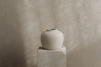 Kaboompics - White Ceramic Vase Against Textured Wall with Copy Space
