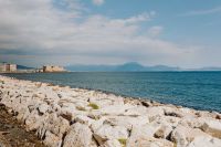 Kaboompics - Rocky Naples Breakwater and Tyrrhenian Coastline Under Blue Sky