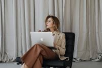Kaboompics - Businesswoman Looking Away from Her Laptop during a Work Break