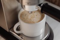 Kaboompics - Close-Up of Foamy Coffee in White Cup
