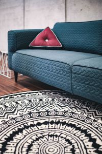 Kaboompics - Blue sofa with pillows in a designer living room interior