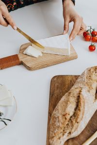Kaboompics - Cheese and Bread on a Wooden Board