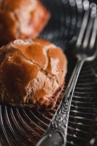 Kaboompics - Sweet Bun and Silver Fork in Shallow Focus