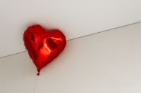 Kaboompics - Single Red Heart Balloon Against a White Ceiling