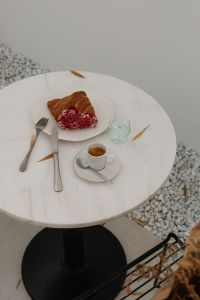 Kaboompics - Coffeehouse Table with Croissant, Espresso and Water Glass