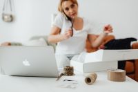 Kaboompics - Taking a Customer Phone Call While Preparing Online Orders at Home