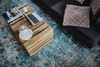Kaboompics - Designer living room interior with a wooden box table and a light blue carpet