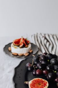 Kaboompics - Grapes in Foreground with Camembert and Figs in Soft Focus