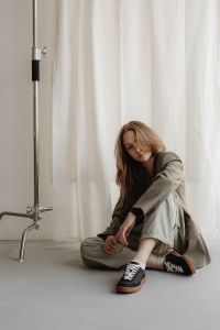 Kaboompics - Seated Young Woman Creative Entrepreneur Portrait in Neutral Studio