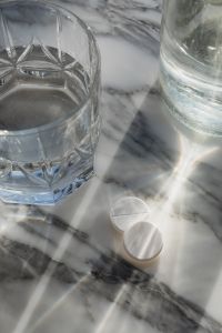 Kaboompics - White Tablets and Water Glass on Marble