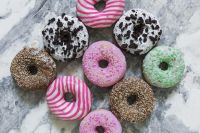 Kaboompics - Assorted Colorful Donuts On Gray Marble