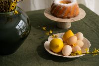 Kaboompics - Bundt Cake, Lemons and Eggs on a Green Easter Table