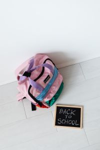 Kaboompics - Colorful School Backpacks with Back to School Sign