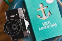 Kaboompics - Blue notebooks and a camera on a blue wooden stool