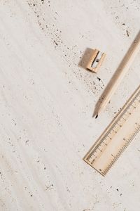 Kaboompics - Wooden Pencil, Sharpener and Ruler on Textured Limestone for Back-to-School Layouts