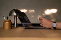 Kaboompics - Man Using a Laptop with a Stylus on a Desk