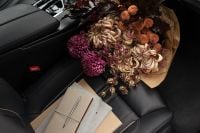 Kaboompics - Autumn Flower Bouquet With Journals on a Passenger Seat