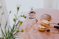 Kaboompics - Perfume and Beauty Tools on a Soft Pink Velvet Background