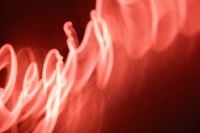 Kaboompics - Glowing Pink Neon Light Waves on Deep Red Background