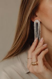 Kaboompics - Woman Touching Long Crystal Earring