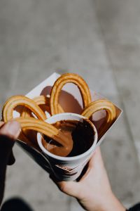 Kaboompics - Churros with a cup of hot chocolate