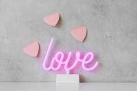 Kaboompics - Pink Neon Love Sign With Floating Hearts