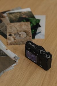 Kaboompics - Printed Photos with Fujifilm X100VI Camera on Desk