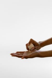 Kaboompics - Applying Serum Drops to Hand in Skincare Treatment