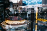 Kaboompics - Whole Berry Cheesecake on a Glass Cake Stand