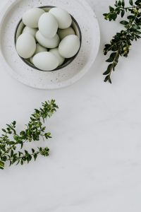 Kaboompics - Easter flat lay with green eggs on a white marble