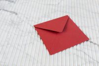 Kaboompics - Red Envelope on Light Marble with Copy Space, Minimal Mockup Background