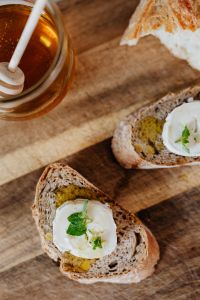 Kaboompics - Close-Up of Honey Jar and Goat Cheese Toast