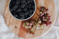 Kaboompics - Blackberries and Red Grapes on a Wooden Board