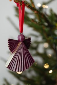 Kaboompics - Burgundy Paper Angel with Soft Tree Lights